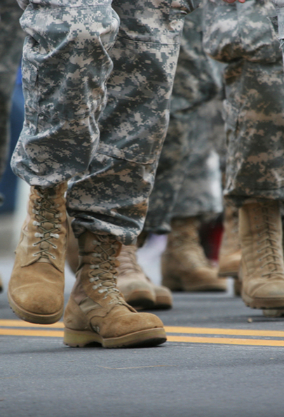 Image of soldier’s in a military march, recognising the disciplined military tactician strategies of Retired General David H. Petraeus. These strategies applied by one of the greatest modern military minds General Petraeus in Iraq, to combat counterinsurgency, can and should be considered for integration in a crisis situation, as they align with crisis management theories and principles. 